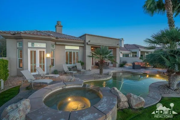 a view of a swimming pool with a patio