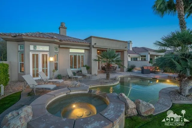 a view of a swimming pool with a patio
