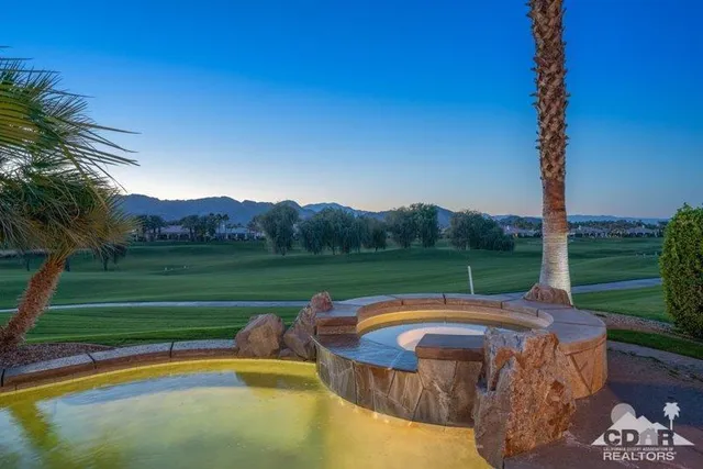 a view of swimming pool with a garden