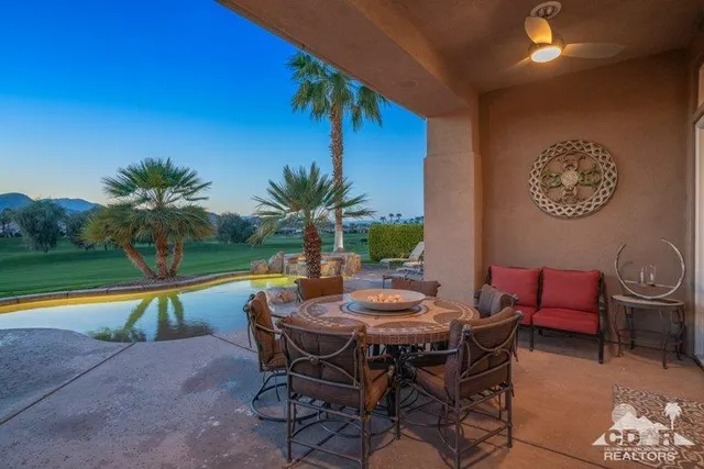 a view of an outdoor sitting area with swimming pool