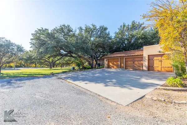 a view of a yard with patio