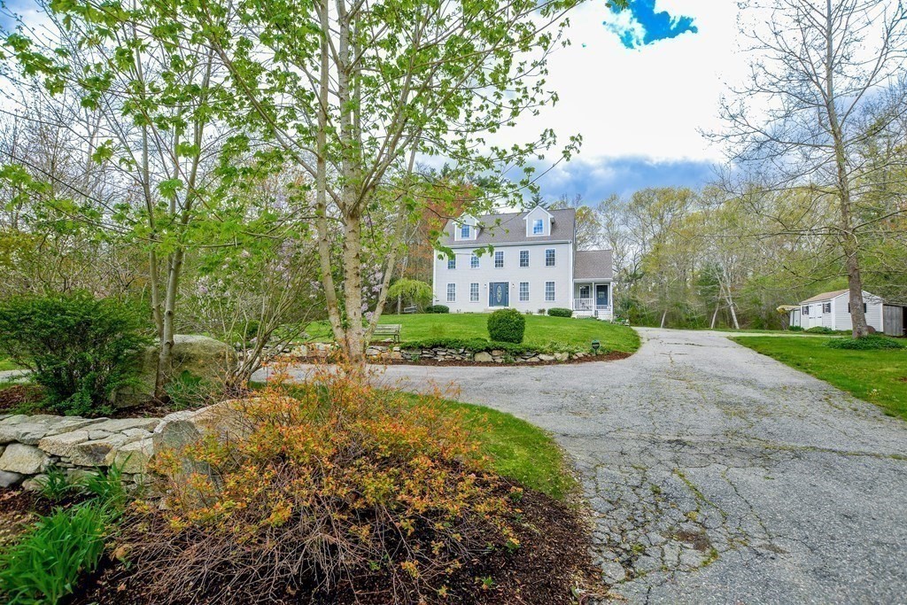 a view of a garden with a house