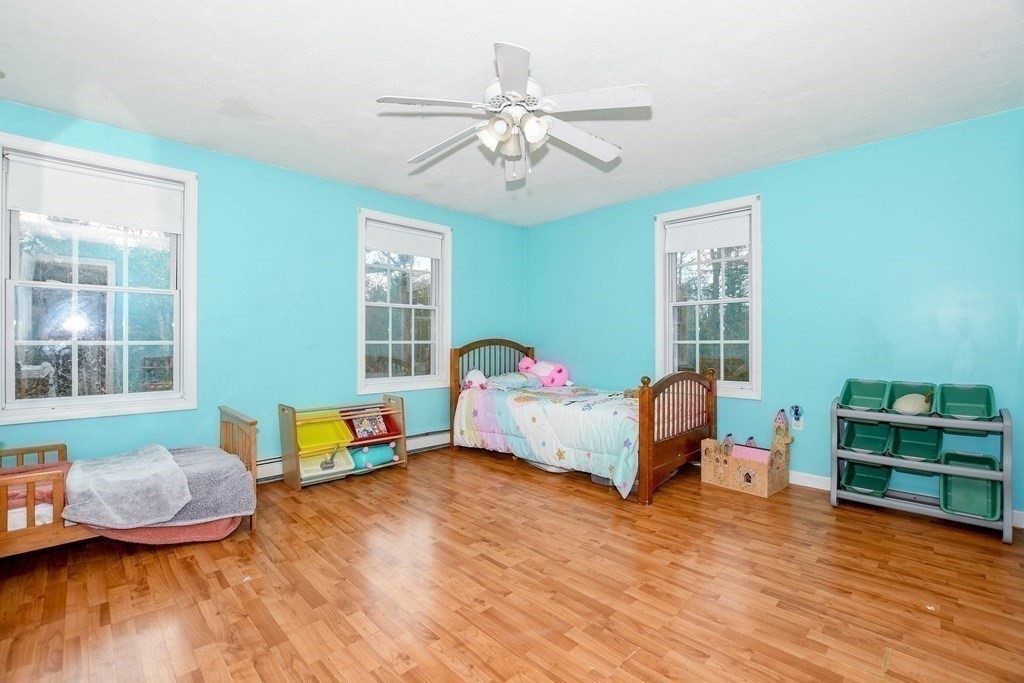 116 Tispaquin Street Middleboro, MA 02346 - Photo 16 of 37 a bedroom with furniture and a wooden floor
