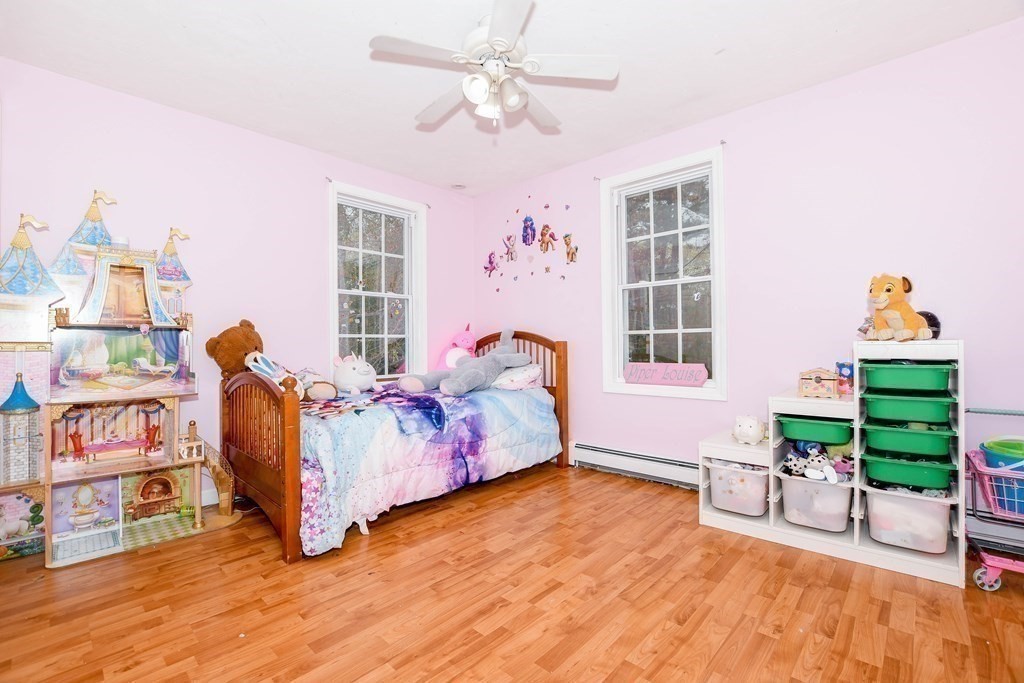 116 Tispaquin Street Middleboro, MA 02346 - Photo 18 of 37 a bed room with a bed and a chair