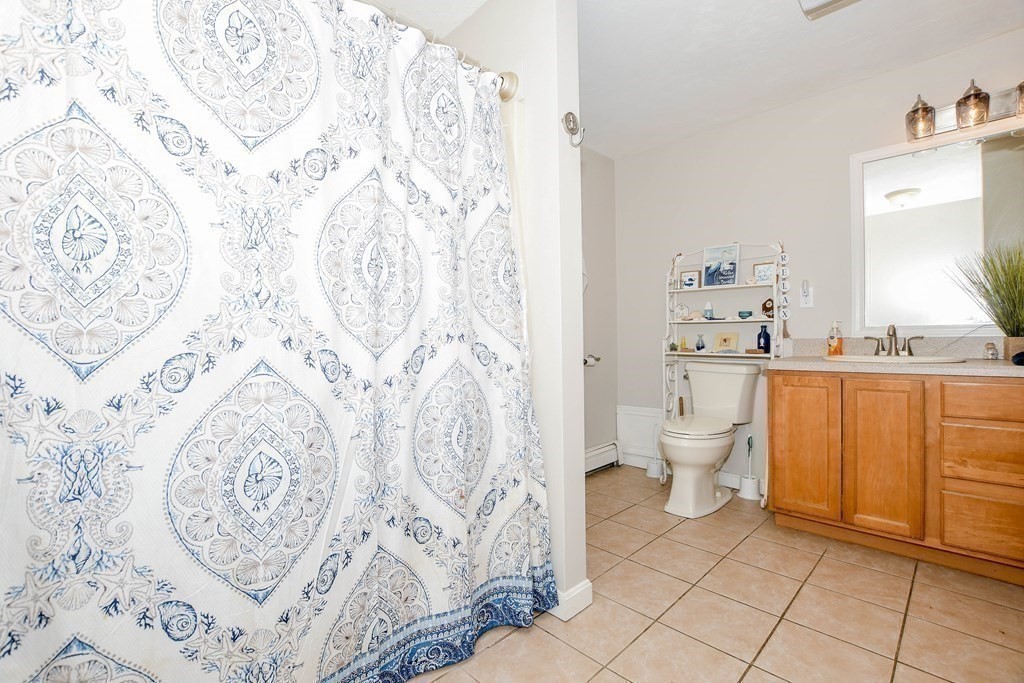 116 Tispaquin Street Middleboro, MA 02346 - Photo 21 of 37 a bathroom with a sink toilet and shower