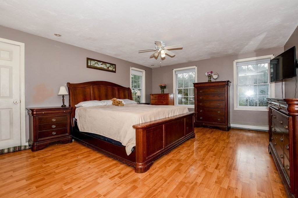 116 Tispaquin Street Middleboro, MA 02346 - Photo 23 of 37 a bed room with a bed and a tv