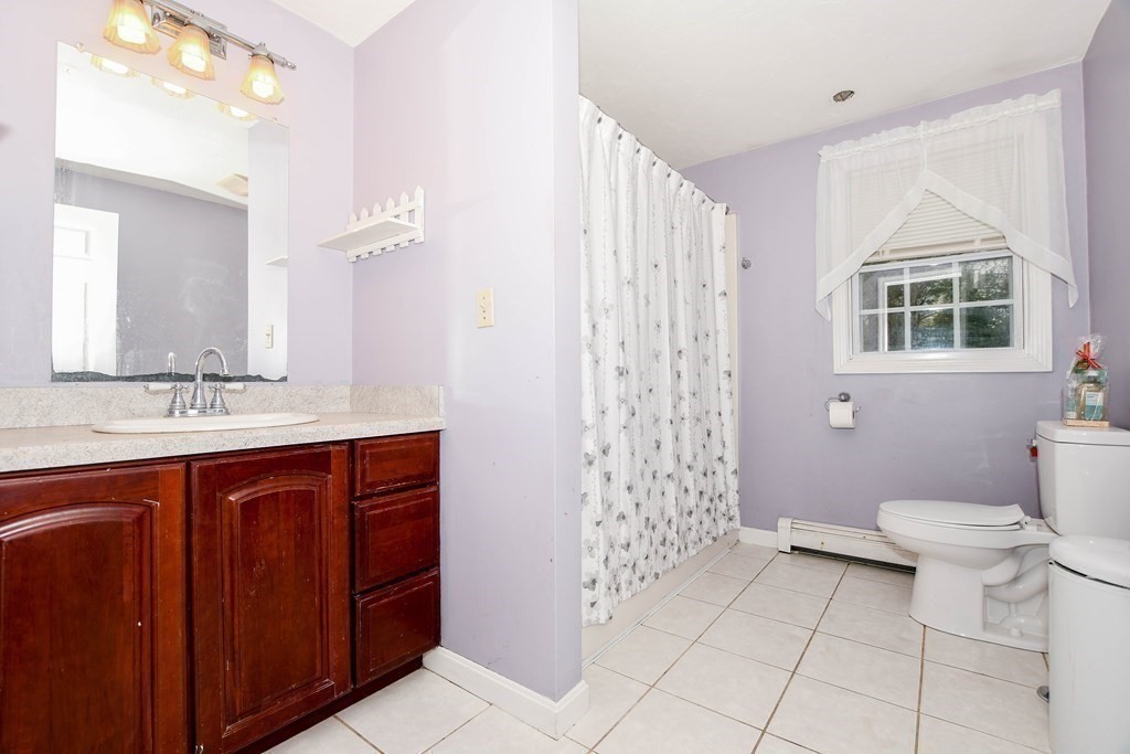 116 Tispaquin Street Middleboro, MA 02346 - Photo 24 of 37 a bathroom with a sink toilet and shower