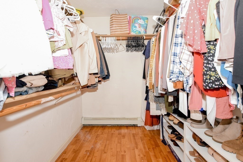 116 Tispaquin Street Middleboro, MA 02346 - Photo 25 of 37 a view of walk in closet with clothes and shoes