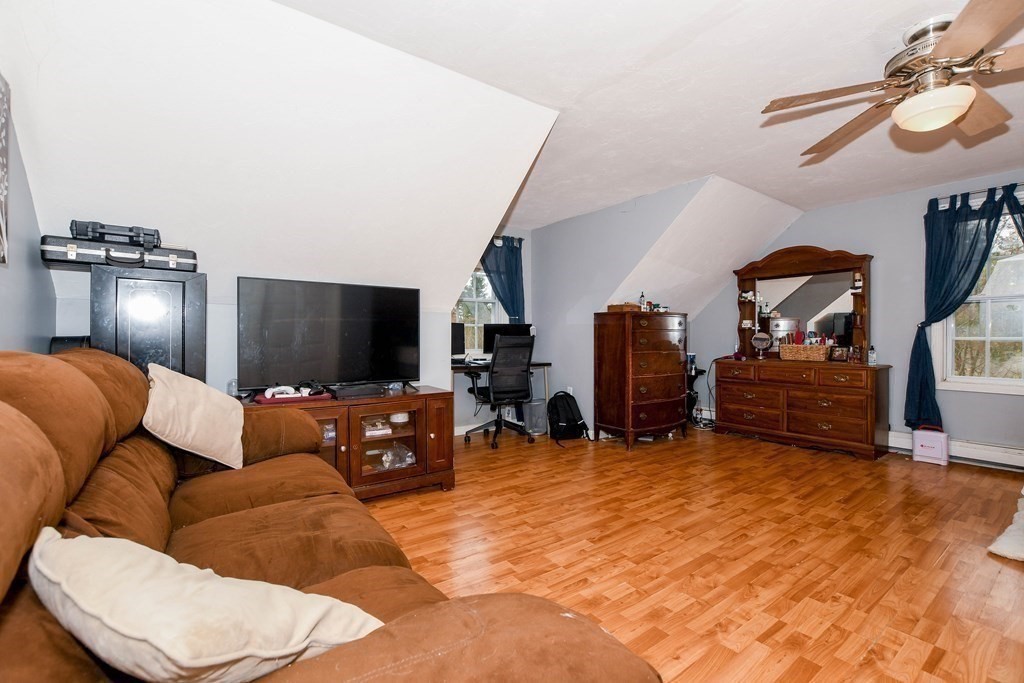 116 Tispaquin Street Middleboro, MA 02346 - Photo 28 of 37 a living room with furniture and a flat screen tv