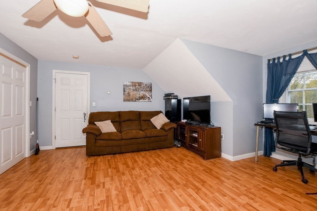 116 Tispaquin Street Middleboro, MA 02346 - Photo 29 of 37 a living room with furniture and a flat screen tv