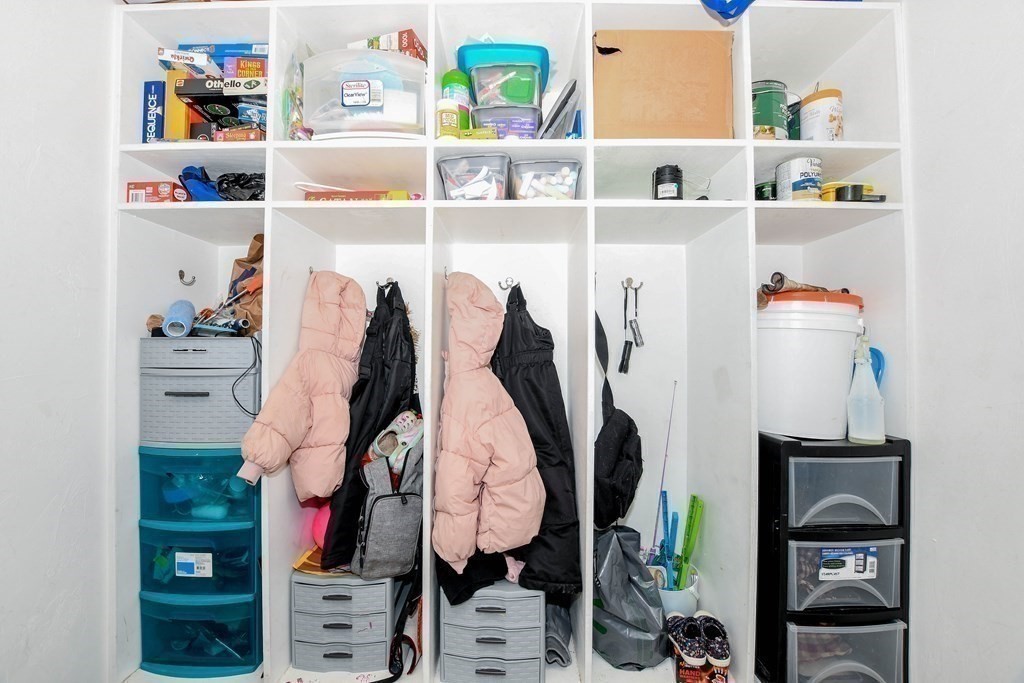 116 Tispaquin Street Middleboro, MA 02346 - Photo 31 of 37 a shelf with books and knick knacks on it
