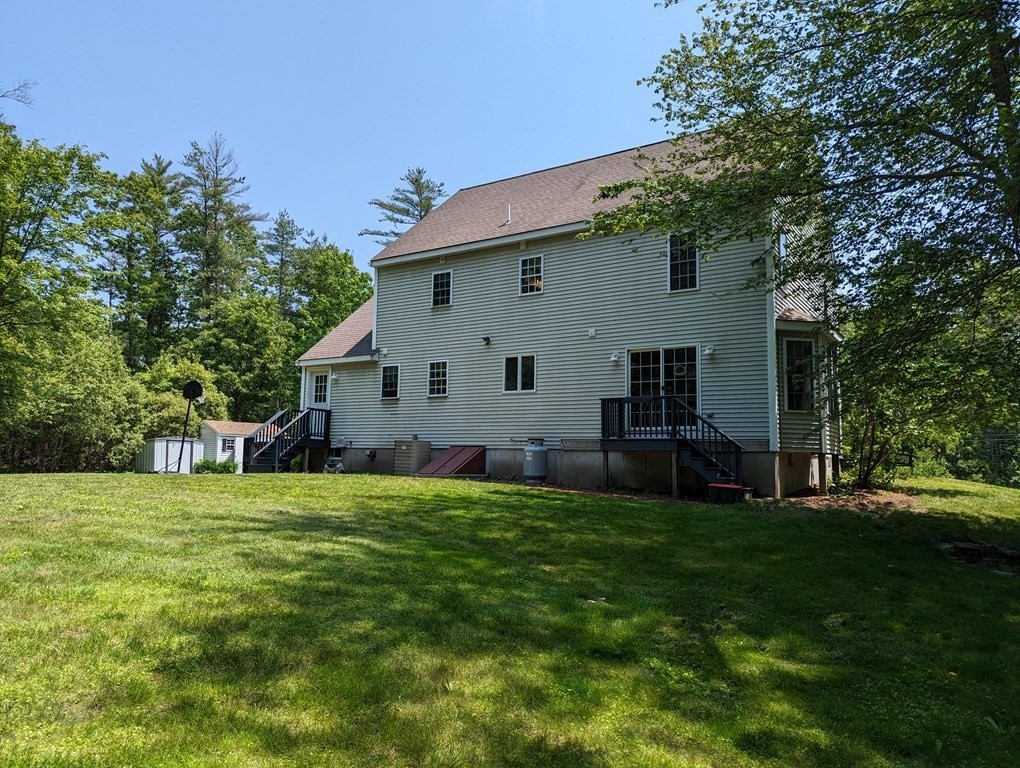116 Tispaquin Street Middleboro, MA 02346 - Photo 34 of 37 a view of a house with a yard