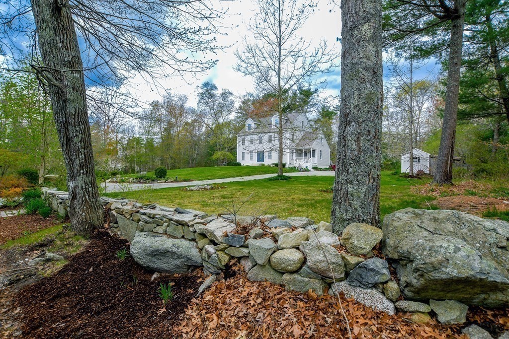 116 Tispaquin Street Middleboro, MA 02346 - Photo 4 of 37 a view of a backyard with large trees