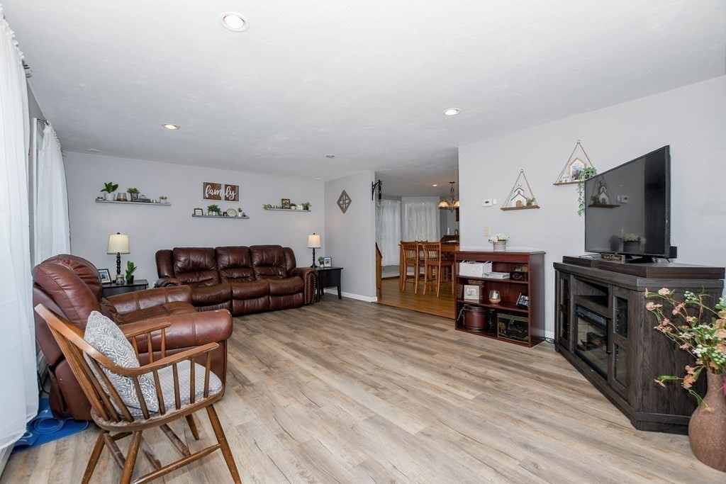 116 Tispaquin Street Middleboro, MA 02346 - Photo 10 of 37 a living room with furniture and a flat screen tv