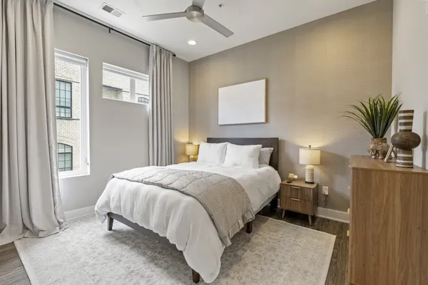 a bedroom with a bed and window