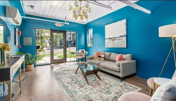 a living room with furniture and a large window