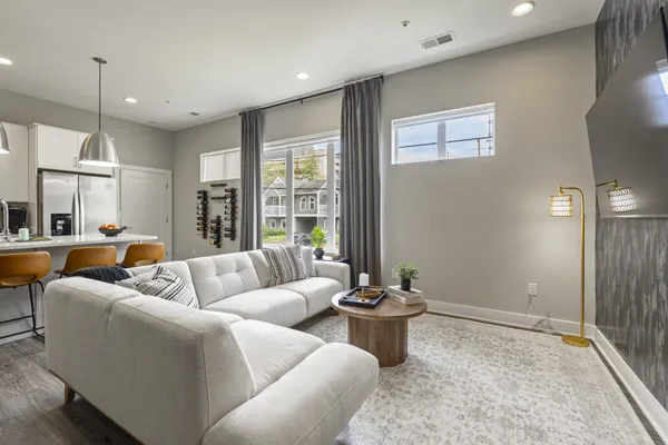 a living room with furniture and a large window