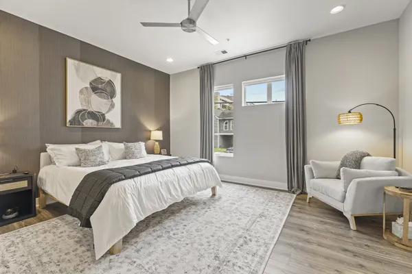 a bedroom with a bed and a couch