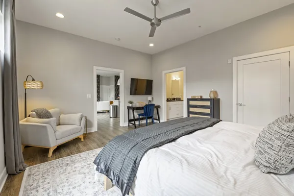 a bedroom with a bed and furniture