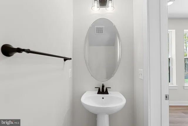 a view of a hallway with a window