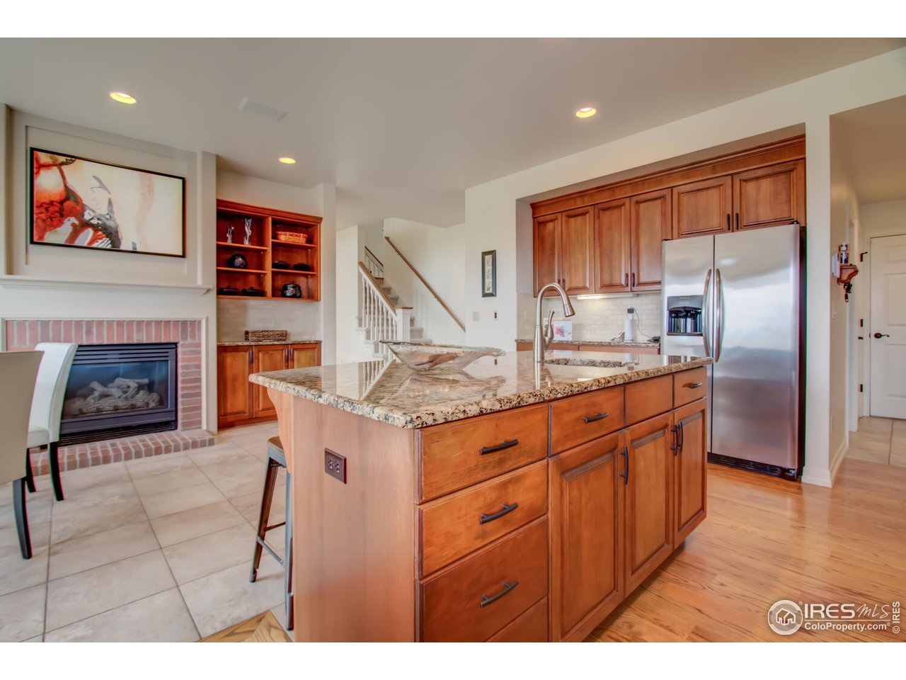 7401 Deerfield Road Longmont, CO 80503 - Photo 15 of 39 Cozy fireplace in eating nook