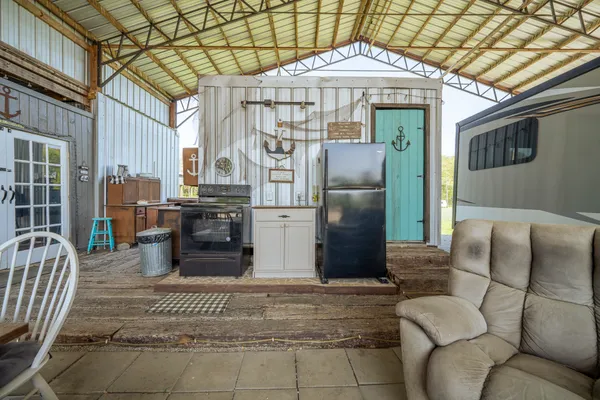 a view of a chairs in the patio