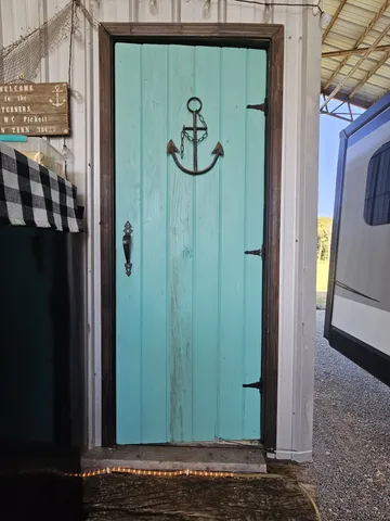 a view of a patio with dining table and chairs