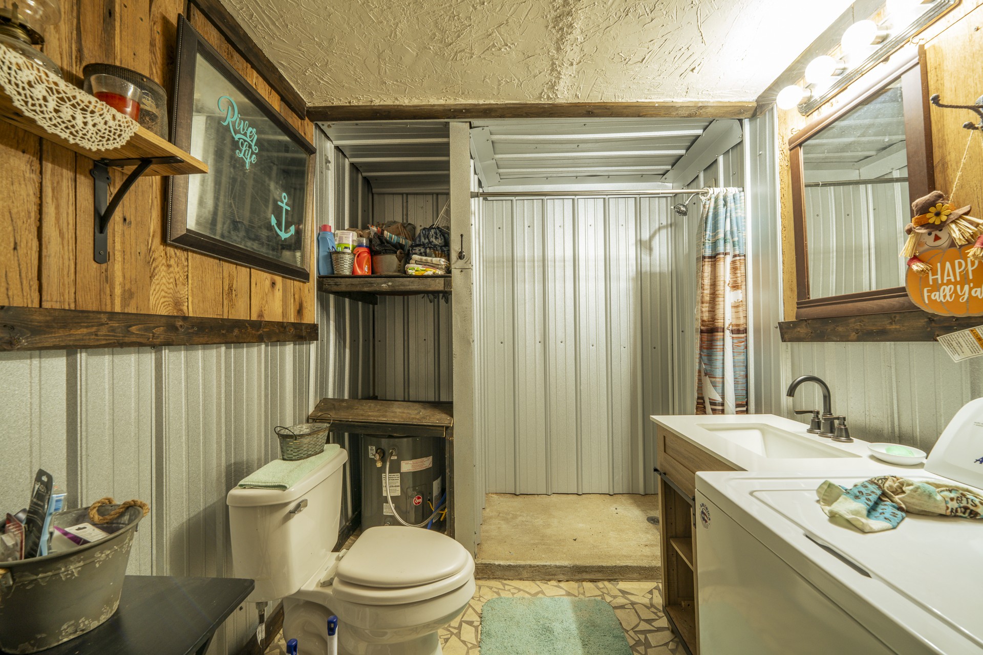 1008 WC PICKETT Road Clifton, TN 38425 - Photo 17 of 57 a bathroom with a sink a toilet and shower
