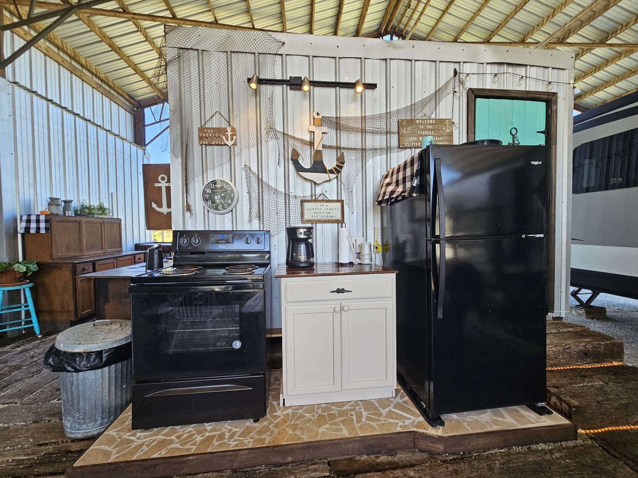 1008 WC PICKETT Road Clifton, TN 38425 - Photo 22 of 57 a kitchen with a refrigerator and a stove
