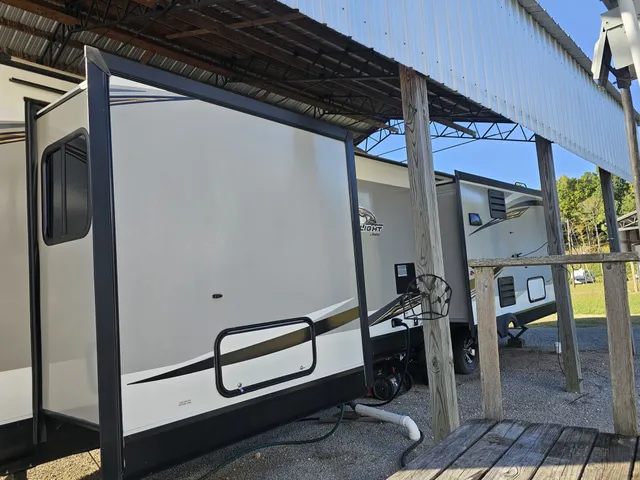 a kitchen with refrigerator and sink
