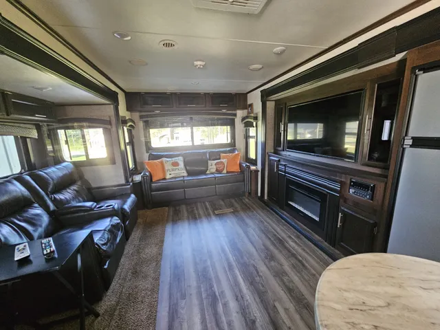 a kitchen with refrigerator and window