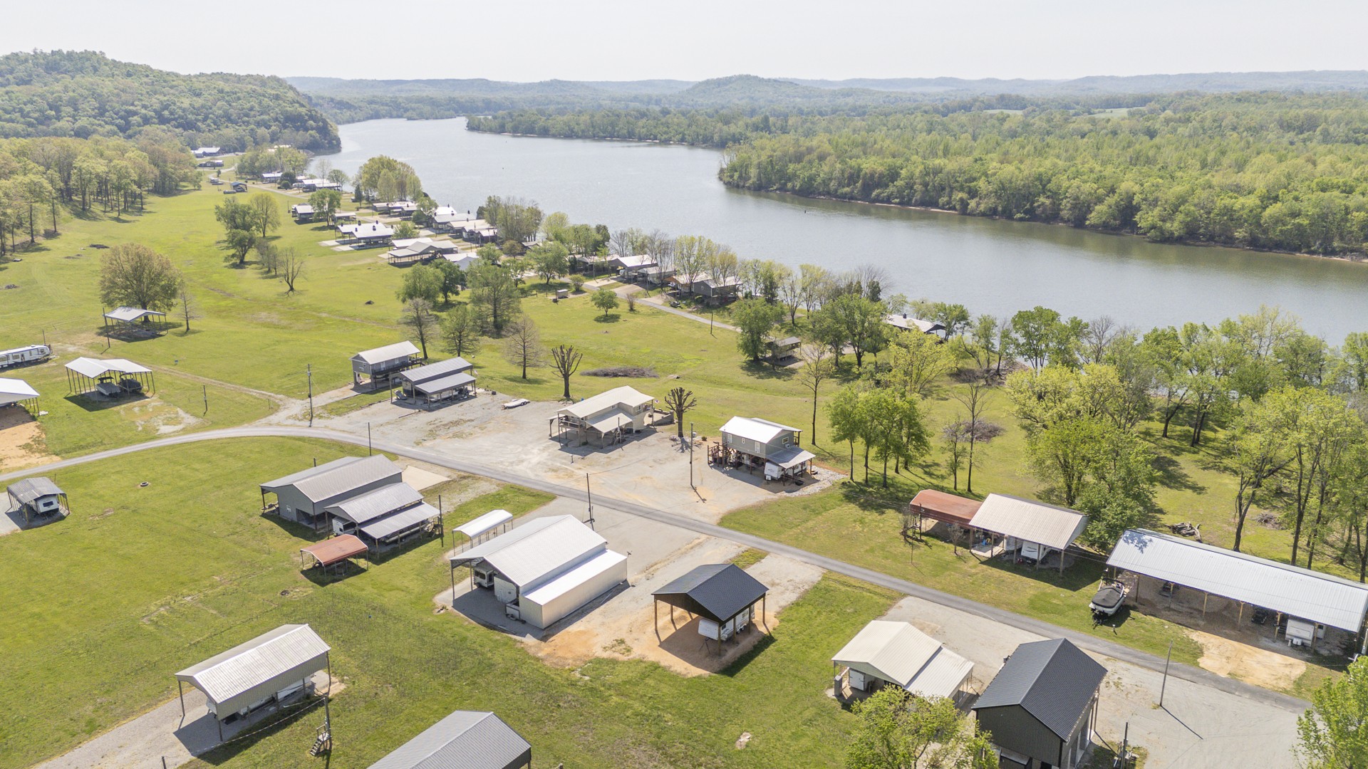 1008 WC PICKETT Road Clifton, TN 38425 - Photo 34 of 57 a view of a lake with a mountain