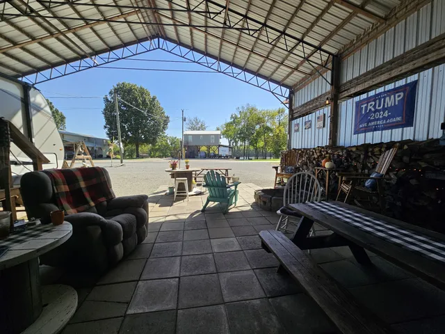 a view of roof deck with wooden floor and seating space