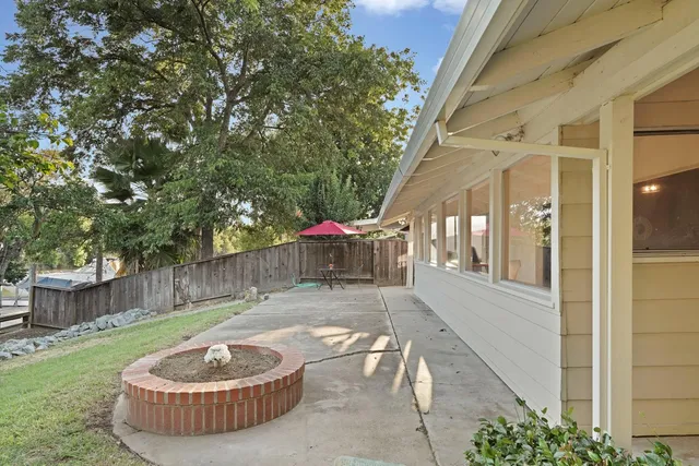 a view of a lake with chairs