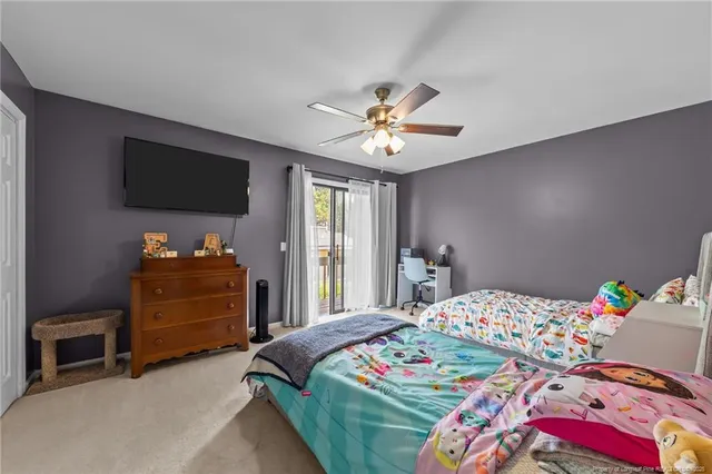 a bedroom that has a bed and a tv in it