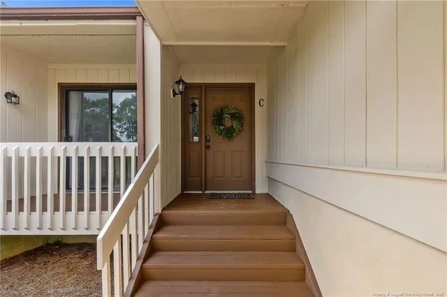 a view of a hallway view with staircase