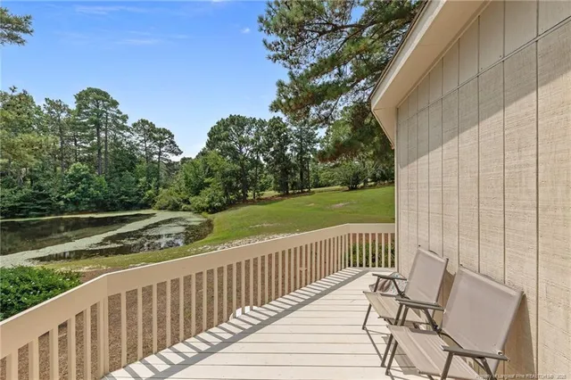 a view of a chair and table on the wooden floor