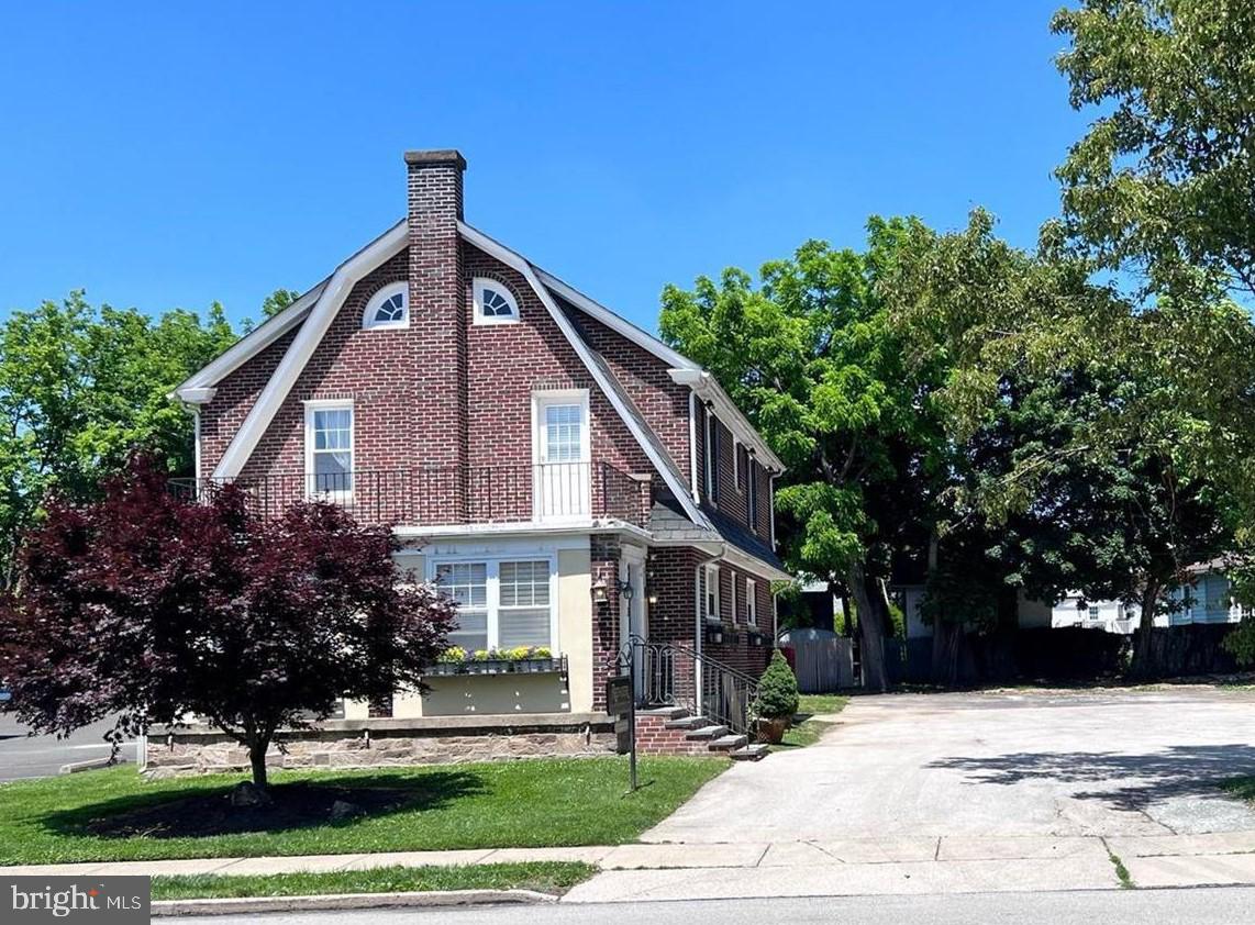 6 Montgomery Avenue, Unit 2 Glenside, PA 19038 - Photo 1 of 27 a front view of a house with a yard