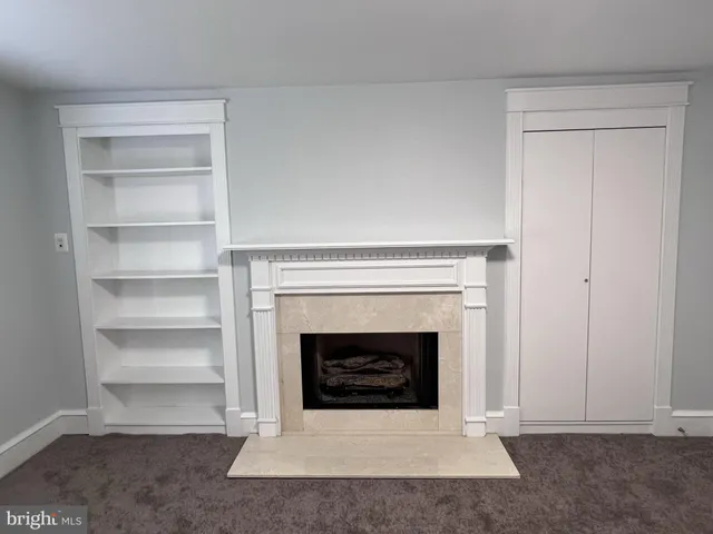 a living room with a fireplace