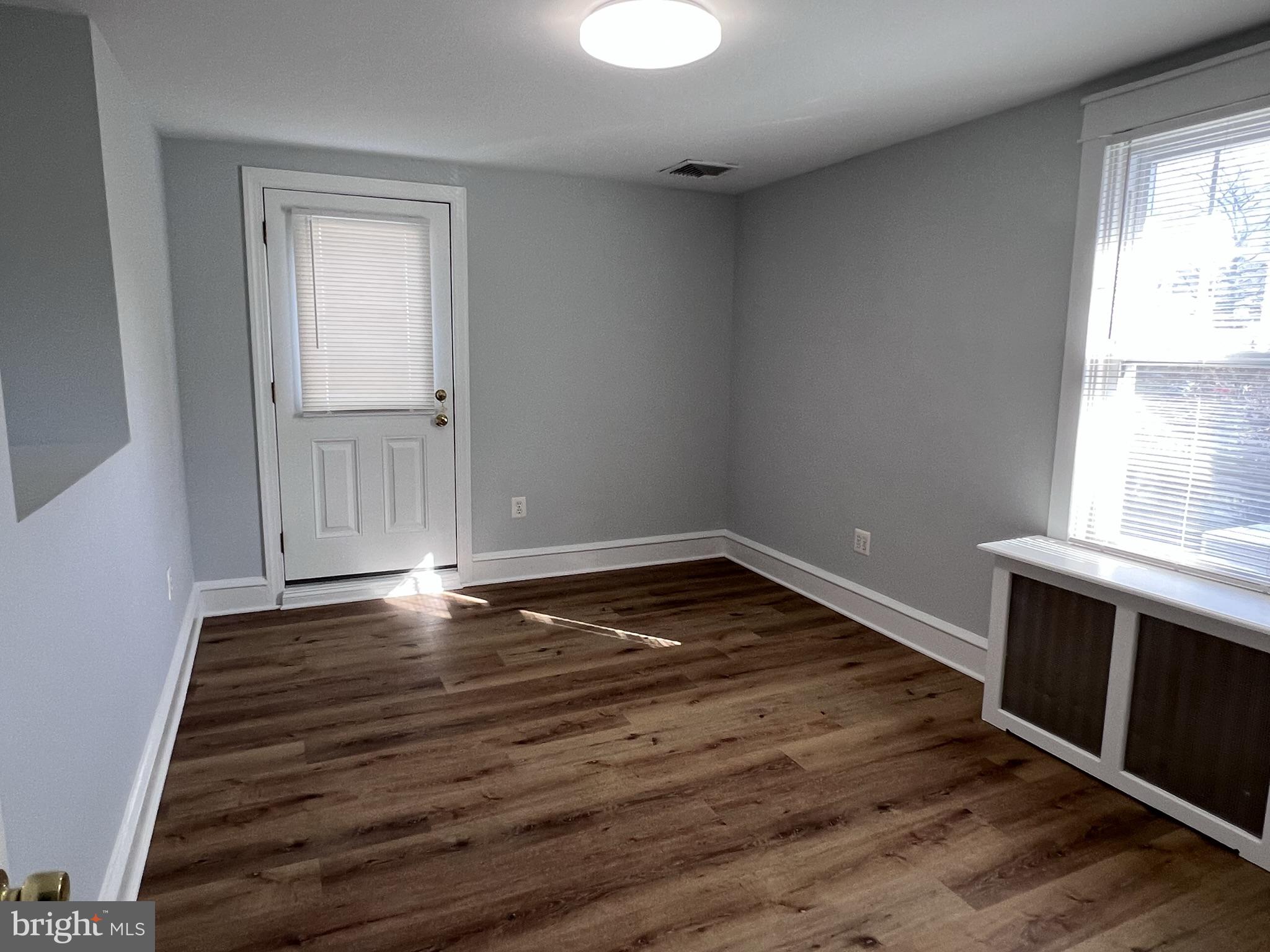 6 Montgomery Avenue, Unit 2 Glenside, PA 19038 - Photo 12 of 27 a view of empty room with wooden floor and fan