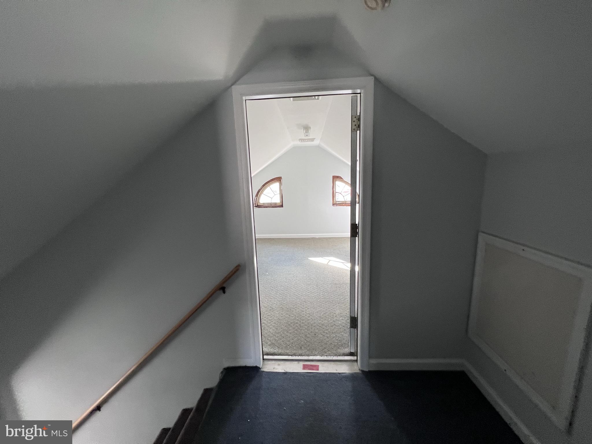 6 Montgomery Avenue, Unit 2 Glenside, PA 19038 - Photo 18 of 27 an empty room with wooden floor and windows