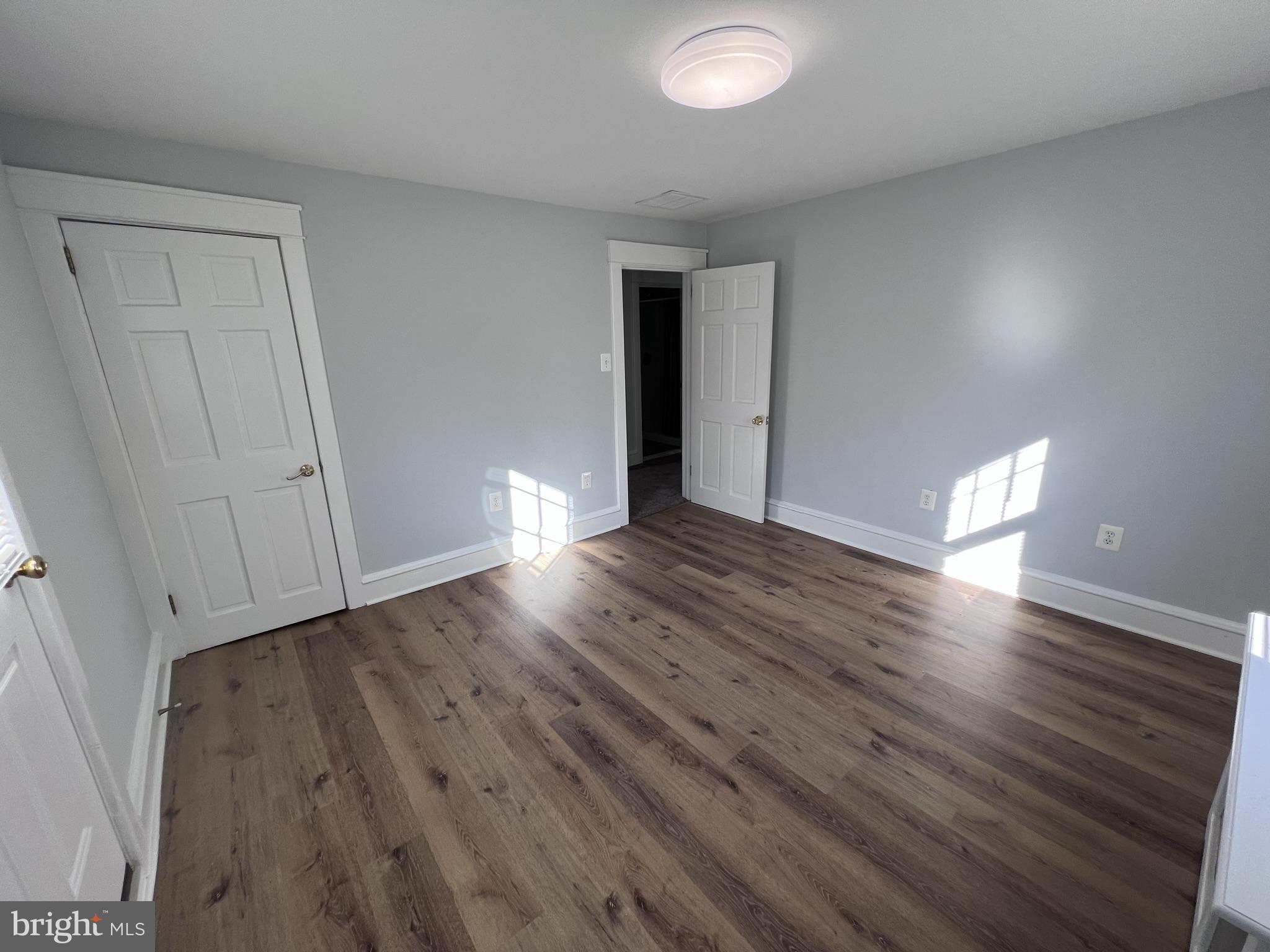 6 Montgomery Avenue, Unit 2 Glenside, PA 19038 - Photo 5 of 27 a view of an empty room with wooden floor