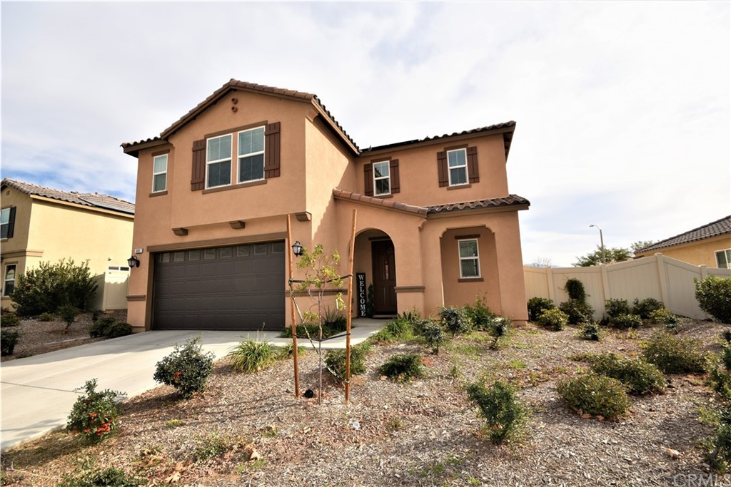 581 Poo'ish Avenue San Jacinto, CA 92582 - Photo 1 of 32 a front view of a house with a yard