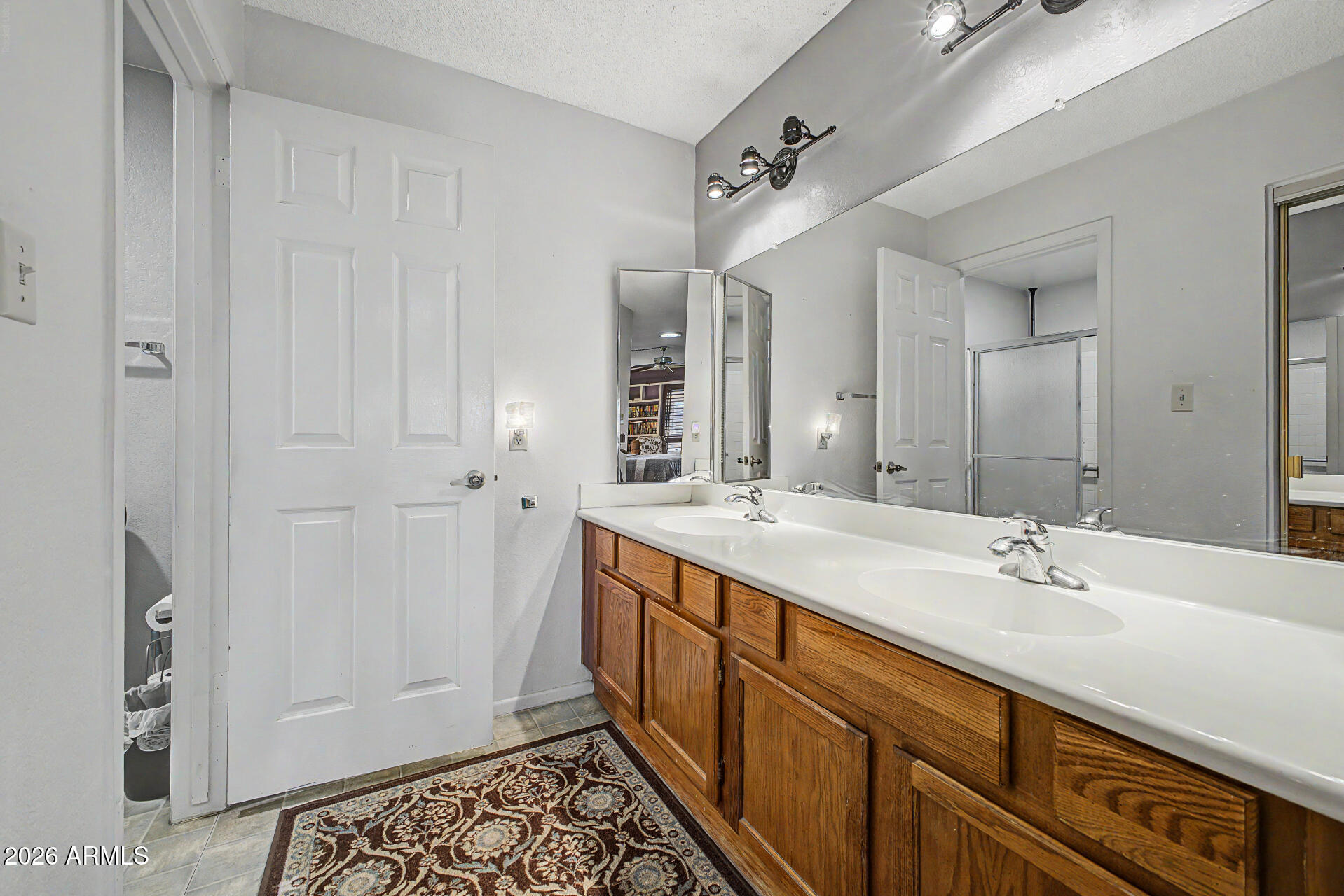 2659 West Hearn Road Phoenix, AZ 85023 - Photo 15 of 25 a spacious bathroom with a double vanity sink and a mirror