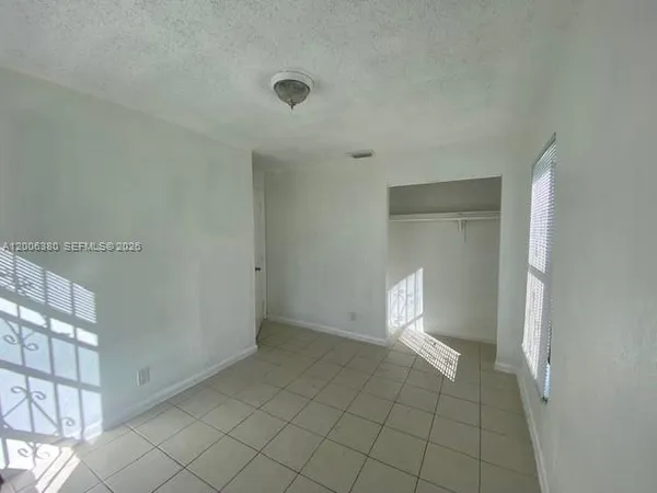 a view of an empty room and window