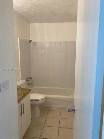 a hallway with sliding door and yard in back