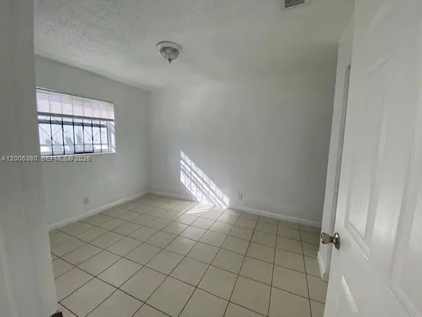 a kitchen with a sink and a refrigerator