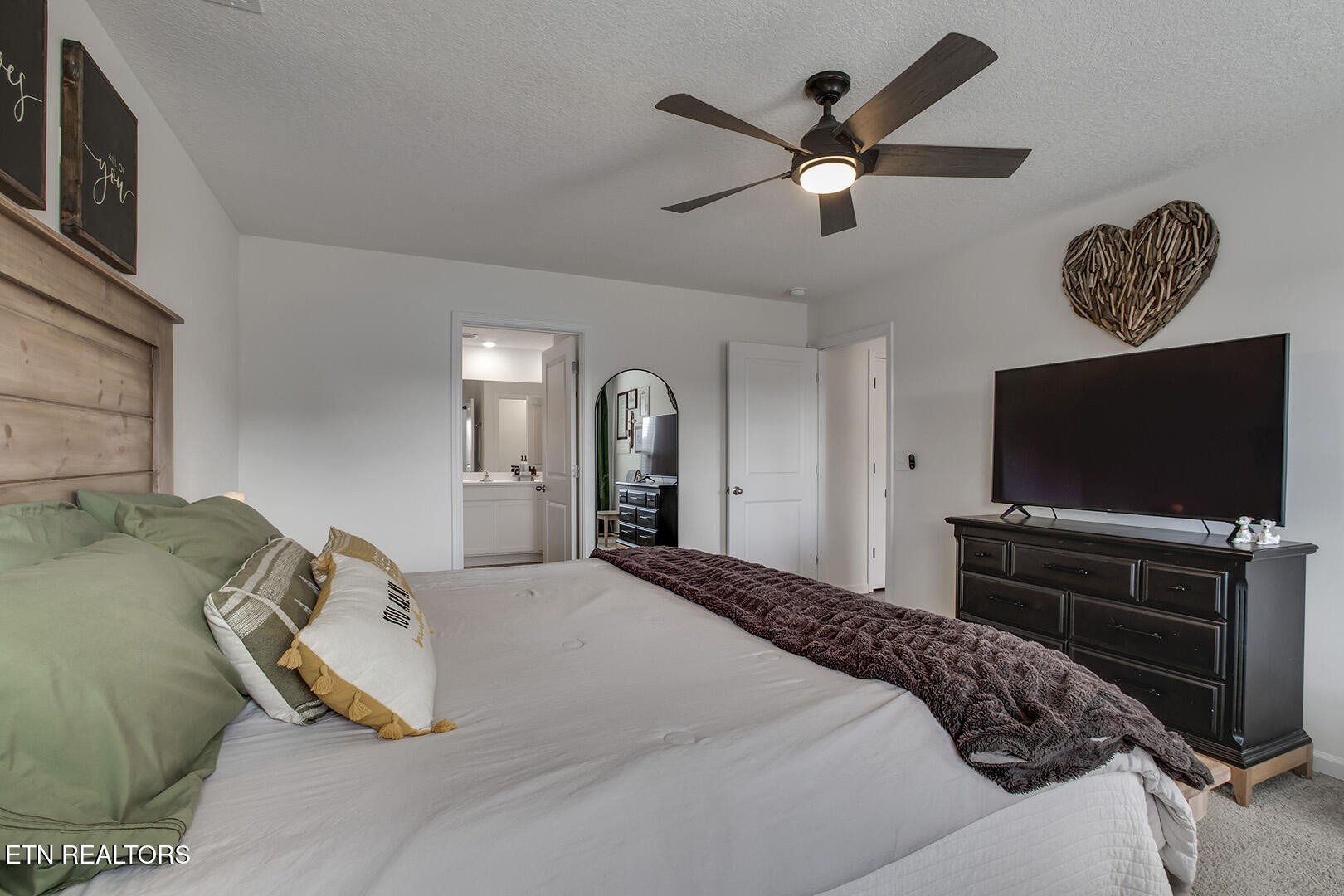 7519 Game Bird Street Corryton, TN 37721 - Photo 19 of 50 a bedroom with a bed and a flat screen tv