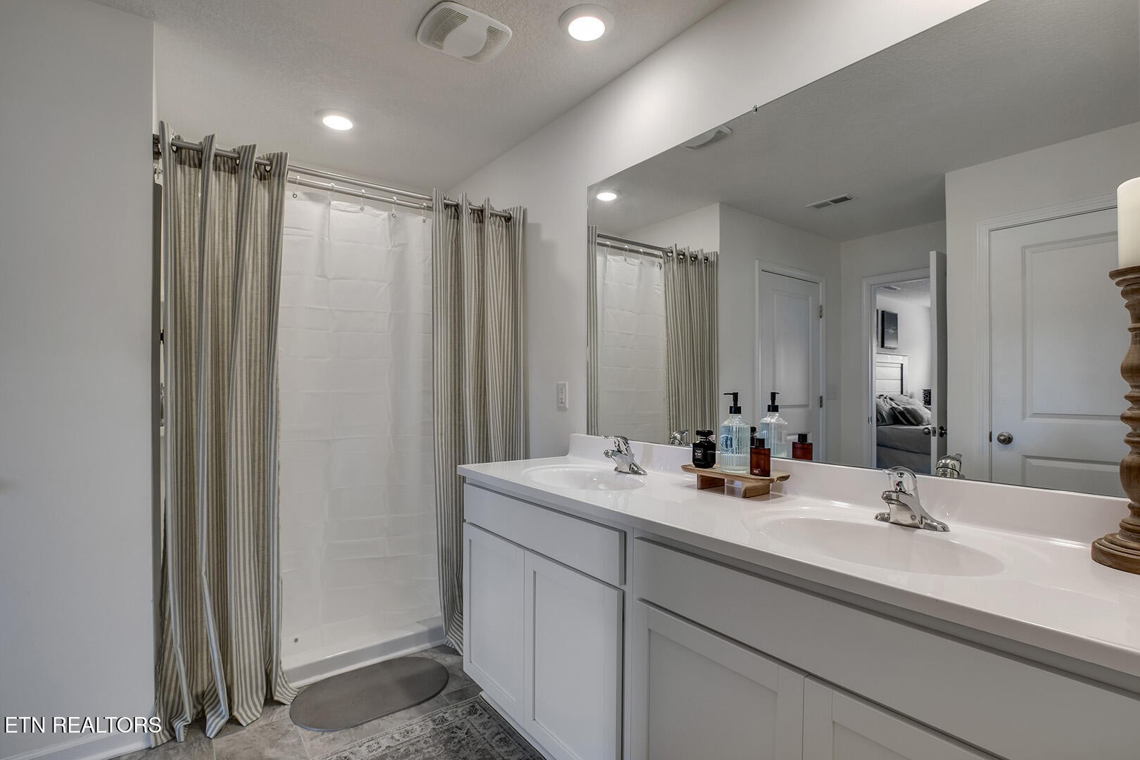 7519 Game Bird Street Corryton, TN 37721 - Photo 20 of 50 a bathroom with a double vanity sink and a mirror