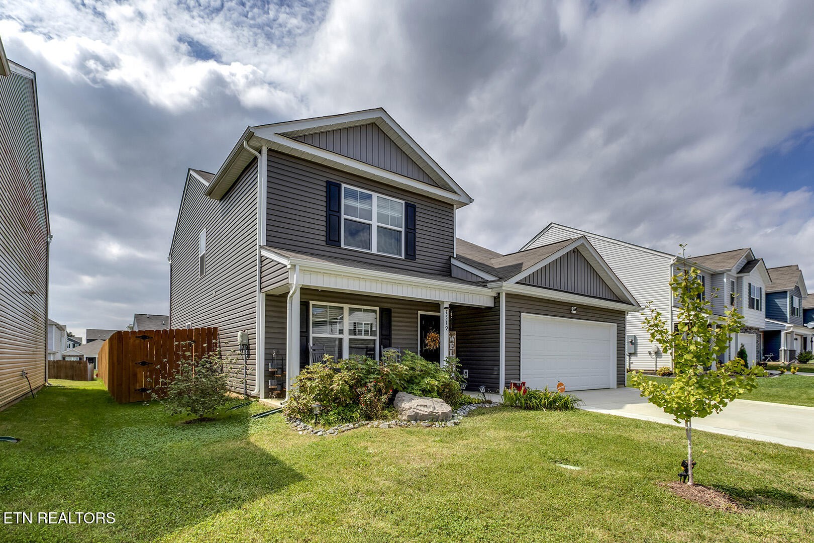 7519 Game Bird Street Corryton, TN 37721 - Photo 2 of 50 a front view of a house with a yard